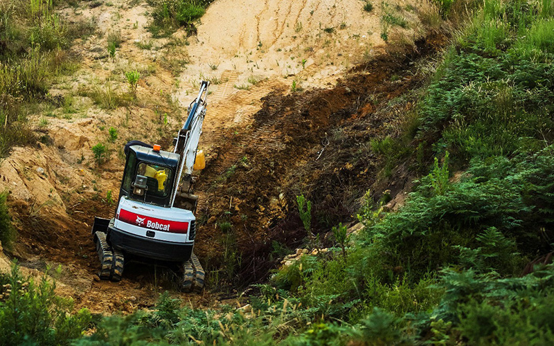 Building The World’s Biggest Bike Jumps With Bobcat Machines 