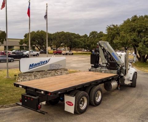 Manitex International has offloaded its Sabre subsidiary. The photo shows an empty flatbed <a href='http://product.global-ce.com/truck/ 'target='_blank' style='color:blue;'>Truck</a> with a Manitex PM knuckle boom crane on it